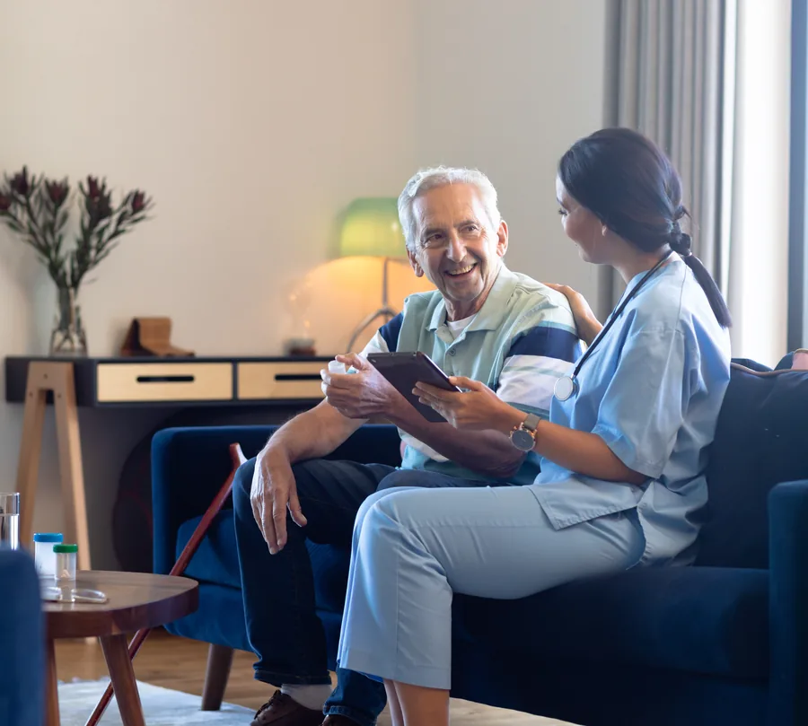 An older man smiling at home